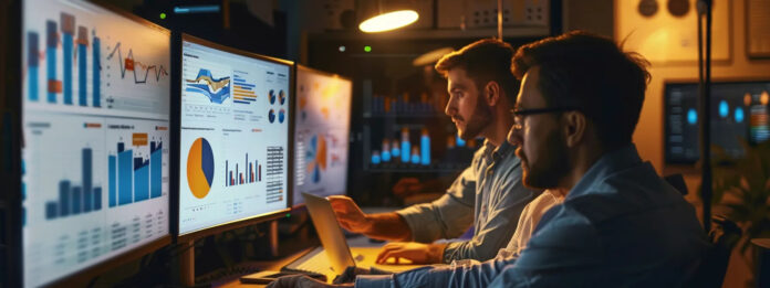Two men focused on a computer screen, reviewing graphs and exploring options for the best Loopio alternative. Two men focused on a computer screen, reviewing graphs and exploring options for the best Loopio alternative.